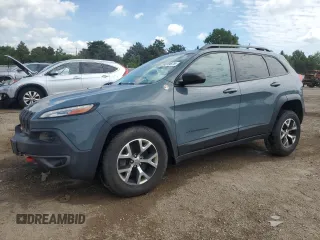 2015 Jeep Cherokee Trailhawk with VIN 1C4PJMBB1FW630715, listed as a Copart auction lot 58559675 with 58,302 mi miles and Salvage title. Bid and sale history available at DreamBid. Image 1.