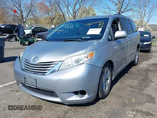 2015 Toyota Sienna LE AAS with VIN 5TDKK3DC0FS663826, listed as a IAAI auction lot 42050229 with 126,971 mi miles and . Bid and sale history available at DreamBid. Image 2.