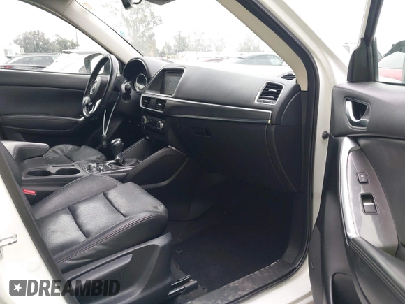 2016 Mazda CX-5 Grand Touring with VIN JM3KE4DY7G0737232, listed as a IAAI auction lot 42158279 with Not Provided miles and . Bid and sale history available at DreamBid. Image 5.
