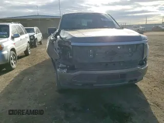 2023 Ford F-150 Lightning Pro с VIN 1FT6W1EV6PWG39428, выставлен на аукционе Copart как лот 46041815 с пробегом 3 396 миль миль и Списание • Salvage title. История ставок и продаж доступна на DreamBid. Изображение 11.