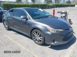 2015 Scion tC with VIN JTKJF5C74F3090309, listed as a IAAI auction lot 41988036 with 158,240 mi miles. Bid and sale history available at carsss.com. Image 1.