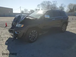 2017 Jeep Grand Cherokee Overland with VIN 1C4RJECG2HC712823, listed as a Copart auction lot 48063325 with 124,812 mi miles and Salvage Title. Bid and sale history available at carsss.com. Image 1.