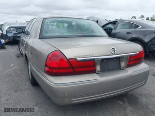2004 Mercury Grand Marquis LS Premium with VIN 2MEFM75W44X604564, listed as a IAAI auction lot 41740462 with 119,693 mi miles. Bid and sale history available at carsss.com. Image 3.