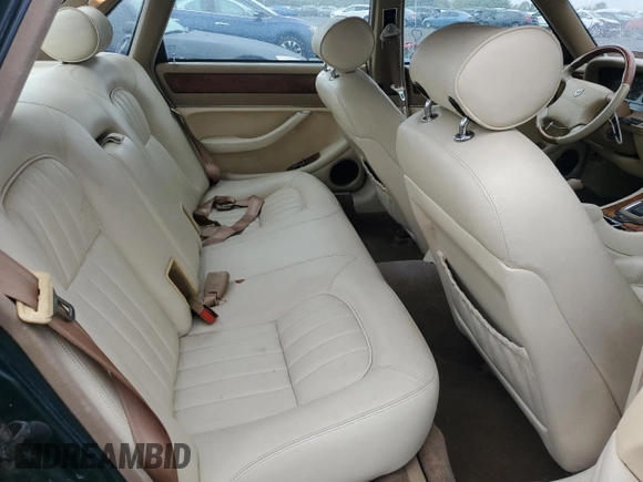 1996 Jaguar XJ with VIN SAJHX1741TC758740, listed as a Copart auction lot 73377914 with 140,964 mi miles and Salvage title. Bid and sale history available at DreamBid. Image 10.