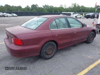 2003 Mitsubishi Galant ES z VIN 4A3AA46G53E215763, wystawiony jako IAAI lot #42275876 z przebiegiem 200 728 mil mil oraz . Historia ofert i sprzedaży dostępna na DreamBid. Obrazek 4.