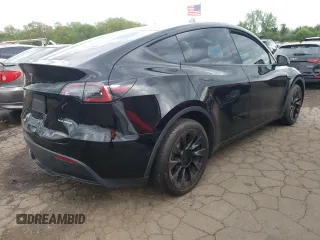 2022 Tesla Model Y Long Range z VIN 7SAYGDEEXNA008898, wystawiony jako Copart lot #54915445 z przebiegiem 35 467 mil mil oraz Szkoda całkowita • Salvage title. Historia ofert i sprzedaży dostępna na DreamBid. Obrazek 3.