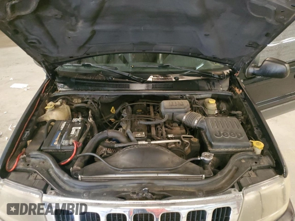 2003 Jeep Grand Cherokee Laredo with VIN 1J4GX48S13C601387, listed as a Copart auction lot 60544295 with 217,485 mi miles and Salvage title. Bid and sale history available at DreamBid. Image 12.