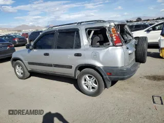 2000 Honda CR-V LX with VIN JHLRD1849YC047923, listed as a Copart auction lot 77041664 with 235,211 mi miles and Salvage Title. Bid and sale history available at carsss.com. Image 2.
