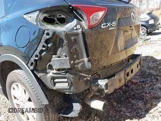 2014 Mazda CX-5 Touring with VIN JM3KE4CY8E0333029, listed as a IAAI auction lot 41857199 with 218,887 mi miles. Bid and sale history available at carsss.com. Image 17.