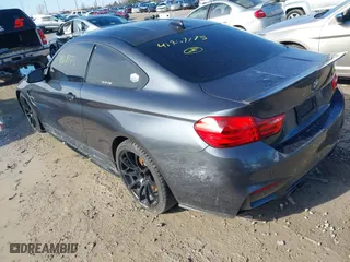 2015 BMW M4 with VIN WBS3R9C57FK334921, listed as a IAAI auction lot 41869773 with 107,058 mi miles. Bid and sale history available at carsss.com. Image 3.