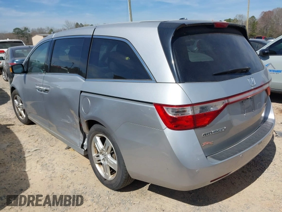 2012 Honda Odyssey Touring with VIN 5FNRL5H92CB108690, listed as a IAAI auction lot 41826580 with 150,327 mi miles and . Bid and sale history available at DreamBid. Image 3.