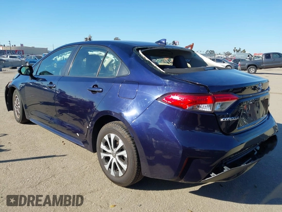 2021 Toyota Corolla Hybrid LE with VIN JTDEAMDEXMJ018828, listed as a IAAI auction lot 41633192 with 63,302 mi miles. Bid and sale history available at carsss.com. Image 3.