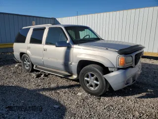 1999 GMC Denali z VIN 1GKEK13R4XR918005, wystawiony jako Copart lot #74964184 z przebiegiem 206 584 mil mil oraz Nie do naprawy. Historia ofert i sprzedaży dostępna na DreamBid. Obrazek 4.