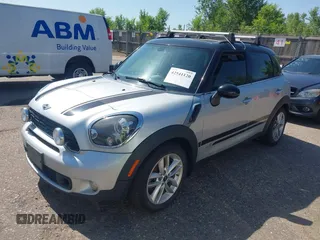 2014 MINI Countryman S with VIN WMWZC5C52EWP36667, listed as a IAAI auction lot 42541120 with 149,331 mi miles and . Bid and sale history available at DreamBid. Image 2.