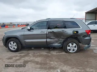 2013 Jeep Grand Cherokee Laredo with VIN 1C4RJEAG2DC571569, listed as a IAAI auction lot 41100518 with 98,265 mi miles. Bid and sale history available at carsss.com. Image 14.