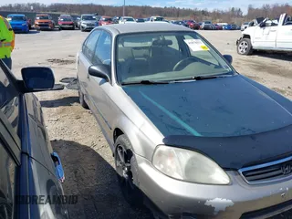 2000 Honda Civic LX z VIN 2HGEJ6676YH523252, wystawiony jako IAAI lot #41878552 z przebiegiem 230 040 mil mil oraz . Historia ofert i sprzedaży dostępna na DreamBid. Obrazek 1.