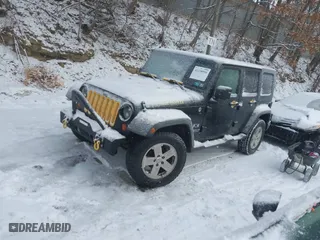 2008 Jeep Wrangler Unlimited X with VIN 1J4GA39148L631198, listed as a IAAI auction lot 41338956 with 154,568 mi miles. Bid and sale history available at carsss.com. Image 17.
