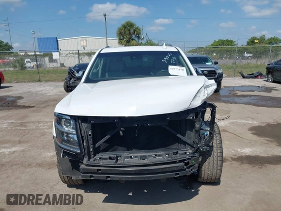2020 Chevrolet Suburban Premier with VIN 1GNSCJKC9LR125292, listed as a IAAI auction lot 42073858 with 92,363 mi miles and . Bid and sale history available at DreamBid. Image 12.