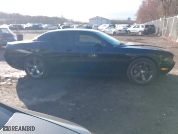 2013 Dodge Challenger SXT with VIN 2C3CDYAG5DH520017, listed as a IAAI auction lot 41882517 with 128,854 mi miles. Bid and sale history available at carsss.com. Image 13.