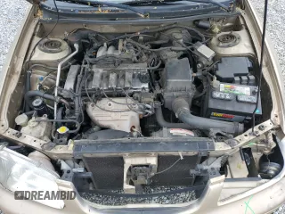 2001 Mazda 626 LX z VIN 1YVGF22C715202574, wystawiony jako Copart lot #54132915 z przebiegiem 237 041 mil mil oraz Szkody całkowita. Historia ofert i sprzedaży dostępna na DreamBid. Obrazek 11.