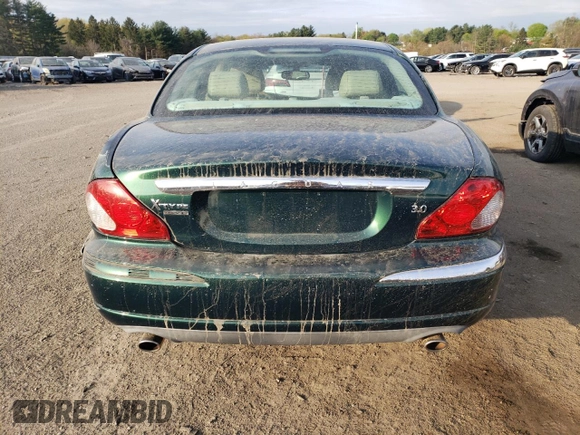 2004 Jaguar X-Type z VIN SAJEA51C04WD65097, wystawiony jako Copart lot #53825295 z przebiegiem 58 270 mil mil oraz Szkoda całkowita • Salvage title. Historia ofert i sprzedaży dostępna na DreamBid. Obrazek 6.