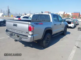 2021 Toyota Tacoma SR with VIN 5TFCZ5AN6MX270972, listed as a IAAI auction lot 42460823 with 76,062 mi miles and . Bid and sale history available at DreamBid. Image 4.