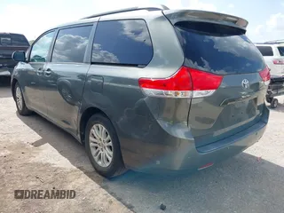 2014 Toyota Sienna XLE with VIN 5TDYK3DC2ES448876, listed as a IAAI auction lot 42519351 with 154,601 mi miles and . Bid and sale history available at DreamBid. Image 3.
