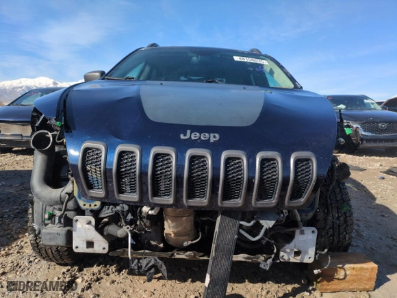 2015 Jeep Cherokee Trailhawk with VIN 1C4PJMBS6FW778665, listed as a Copart auction lot 48158035 with 107,638 mi miles and Salvage Title. Bid and sale history available at carsss.com. Image 5.