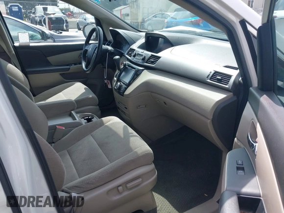 2016 Honda Odyssey SE with VIN 5FNRL5H33GB043303, listed as a IAAI auction lot 42215233 with 67,097 mi miles and . Bid and sale history available at DreamBid. Image 5.
