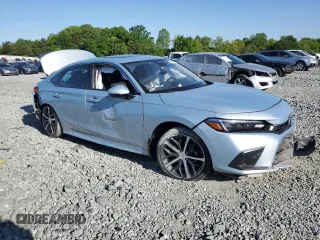 2023 Honda Civic Touring z VIN 2HGFE1F97PH305882, wystawiony jako Copart lot #54826915 z przebiegiem Nie podano mil oraz Szkody całkowita. Historia ofert i sprzedaży dostępna na DreamBid. Obrazek 4.