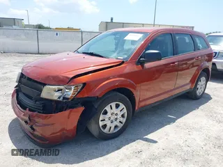 2014 Dodge Journey American Value Pkg with VIN 3C4PDCAB6ET248820, listed as a IAAI auction lot 39159166 with 215,007 mi miles. Bid and sale history available at carsss.com. Image 2.