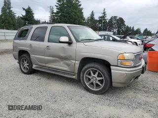 2002 GMC Yukon Denali z VIN 1GKEK63U82J224913, wystawiony jako Copart lot #60664885 z przebiegiem 208 794 mil mil oraz Szkoda całkowita • Salvage title. Historia ofert i sprzedaży dostępna na DreamBid. Obrazek 4.