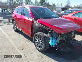 2020 Mazda CX-5 Grand Touring with VIN JM3KFADMXL0780871, listed as a IAAI auction lot 41418137 with 86,756 mi miles. Bid and sale history available at carsss.com. Image 1.