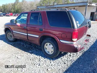 2001 GMC Jimmy SL with VIN 1GKCS13W012143344, listed as a IAAI auction lot 41385552 with 216,127 mi miles. Bid and sale history available at carsss.com. Image 3.