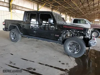 2023 Jeep Gladiator Rubicon with VIN 1C6JJTBG4PL582956, listed as a Copart auction lot 45237665 with 22,797 mi miles and Salvage Title. Bid and sale history available at carsss.com. Image 4.