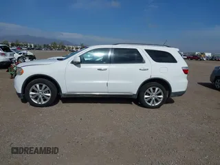 2013 Dodge Durango Crew with VIN 1C4SDHDT2DC679600, listed as a IAAI auction lot 42215737 with 128,499 mi miles and . Bid and sale history available at DreamBid. Image 14.