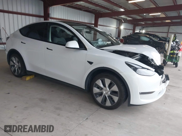 2023 Tesla Model Y Long Range z VIN 7SAYGDEE2PF834036, wystawiony jako IAAI lot #41933120 z przebiegiem 27 872 mil mil oraz . Historia ofert i sprzedaży dostępna na DreamBid. Obrazek 1.