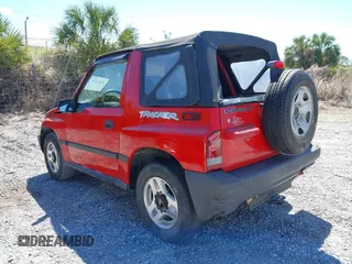 1998 Chevrolet Tracker z VIN 2CNBE1866W6924835, wystawiony jako IAAI lot #41821459 z przebiegiem 54 512 mil mil oraz . Historia ofert i sprzedaży dostępna na DreamBid. Obrazek 3.