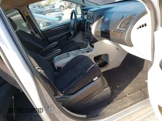 2014 Dodge Grand Caravan SXT z VIN 2C4RDGCG4ER262792, wystawiony jako IAAI lot #40460534 z przebiegiem 245 407 mil mil oraz . Historia ofert i sprzedaży dostępna na DreamBid. Obrazek 5.