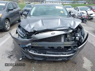 2014 Ford Fusion S with VIN 3FA6P0G70ER377725, listed as a IAAI auction lot 42007410 with 56,552 mi miles and . Bid and sale history available at carsss.com. Image 6.