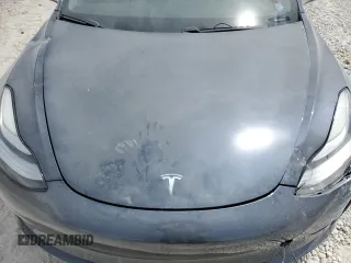 2019 Tesla Model 3 Mid Range z VIN 5YJ3E1EA4KF434741, wystawiony jako Copart lot #53857935 z przebiegiem Nie podano mil oraz Szkody całkowita. Historia ofert i sprzedaży dostępna na DreamBid. Obrazek 11.