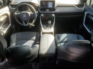 2021 Toyota RAV4 Hybrid XSE with VIN 4T3E6RFV1MU057403, listed as a Copart auction lot 47809415 with 56,570 mi miles and Salvage Title. Bid and sale history available at carsss.com. Image 8.