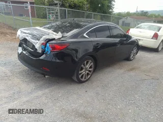 2015 Mazda 6 i Grand Touring with VIN JM1GJ1W68F1168078, listed as a IAAI auction lot 42149519 with 127,641 mi miles and . Bid and sale history available at DreamBid. Image 4.