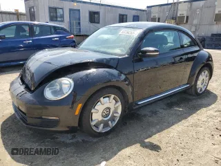 2012 Volkswagen Beetle 2.5L w/Sound/Nav PZEV with VIN 3VWJP7AT7CM646779, listed as a Copart auction lot 53756265 with 116,662 mi miles and Salvage Title. Bid and sale history available at DreamBid. Image 1.