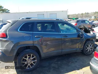 2014 Jeep Cherokee Latitude with VIN 1C4PJLCB1EW153825, listed as a IAAI auction lot 41675220 with 208,943 mi miles. Bid and sale history available at carsss.com. Image 13.