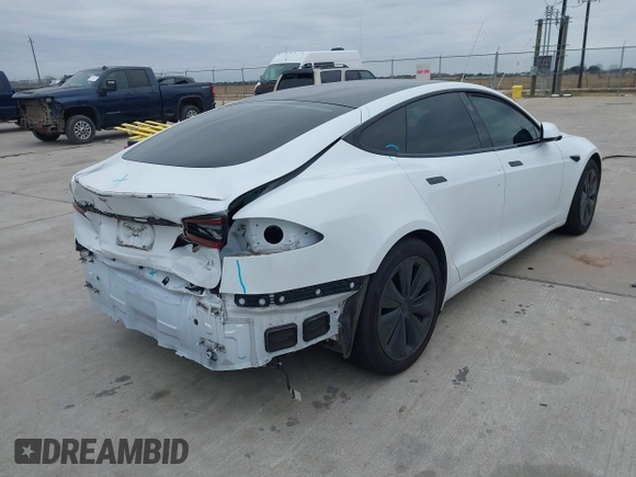 2021 Tesla Model S Plaid z VIN 5YJSA1E64MF452744, wystawiony jako IAAI lot #41375136 z przebiegiem Nie podano mil oraz . Historia ofert i sprzedaży dostępna na DreamBid. Obrazek 4.