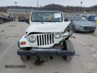 1998 Jeep Wrangler SE with VIN 1J4FY29P9WP793260, listed as a IAAI auction lot 41596990 with 90,766 mi miles. Bid and sale history available at carsss.com. Image 12.