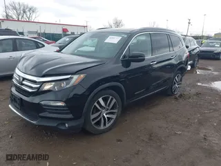 2017 Honda Pilot Touring with VIN 5FNYF6H95HB007854, listed as a IAAI auction lot 41955509 with 103,202 mi miles. Bid and sale history available at carsss.com. Image 18.