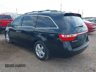 2013 Honda Odyssey Touring with VIN 5FNRL5H95DB086041, listed as a IAAI auction lot 42477974 with 213,343 mi miles and . Bid and sale history available at DreamBid. Image 3.