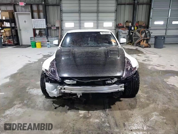 2012 Nissan 370Z z VIN JN1AZ4EH2CM564443, wystawiony jako Copart lot #45126885 z przebiegiem 71 729 mil mil oraz Szkody całkowita. Historia ofert i sprzedaży dostępna na DreamBid. Obrazek 11.